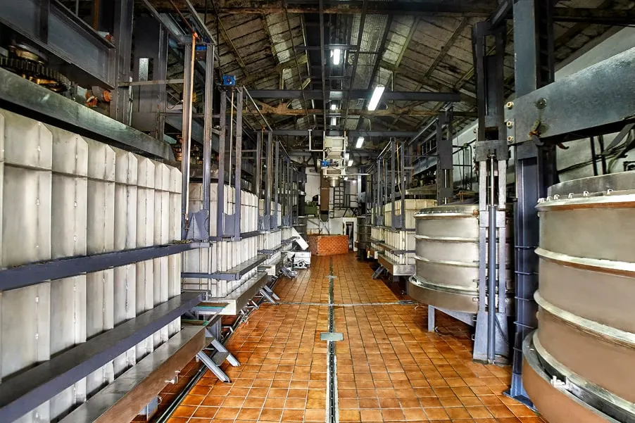 Pressing hall with stainless steel presses lined up on both sides