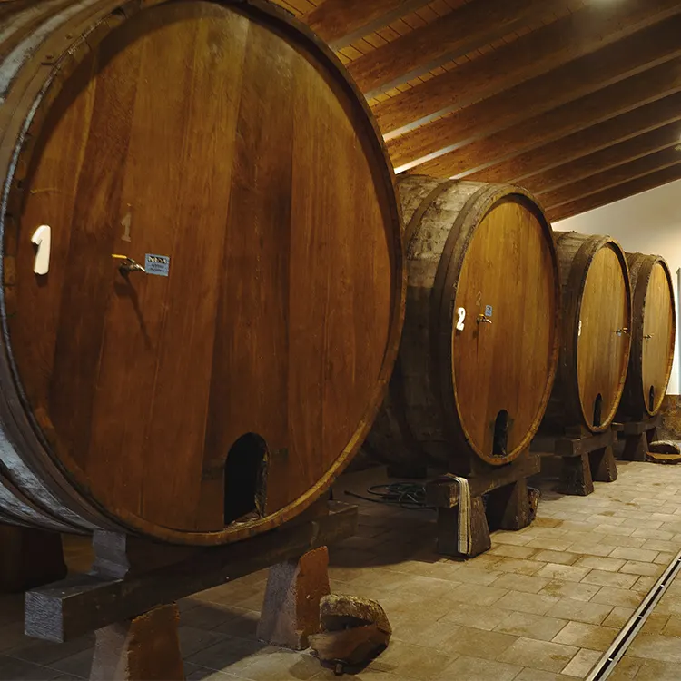 Row of numbered barrels in the cider mill